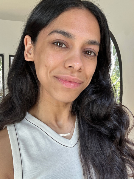 Image may contain Body Part Face Head Neck Person Adult Accessories Jewelry Necklace Black Hair Hair and Dimples