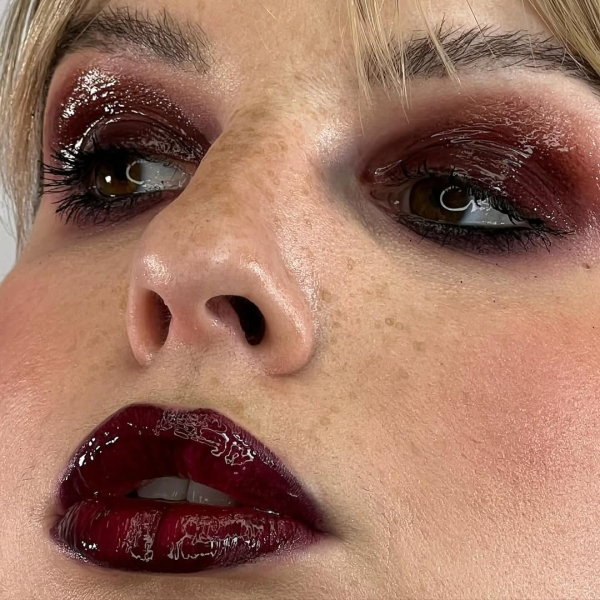 Woman wearing monochromatic red wine makeup