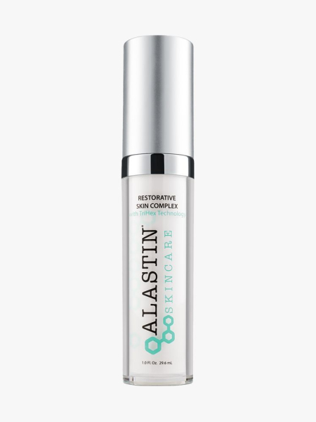 Alastin Restorative Skin Complex bottle of moisturizer with silver cap on light gray background